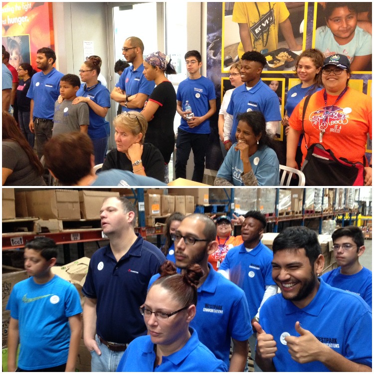 Employees in blue shirts standing - Westpark Communications