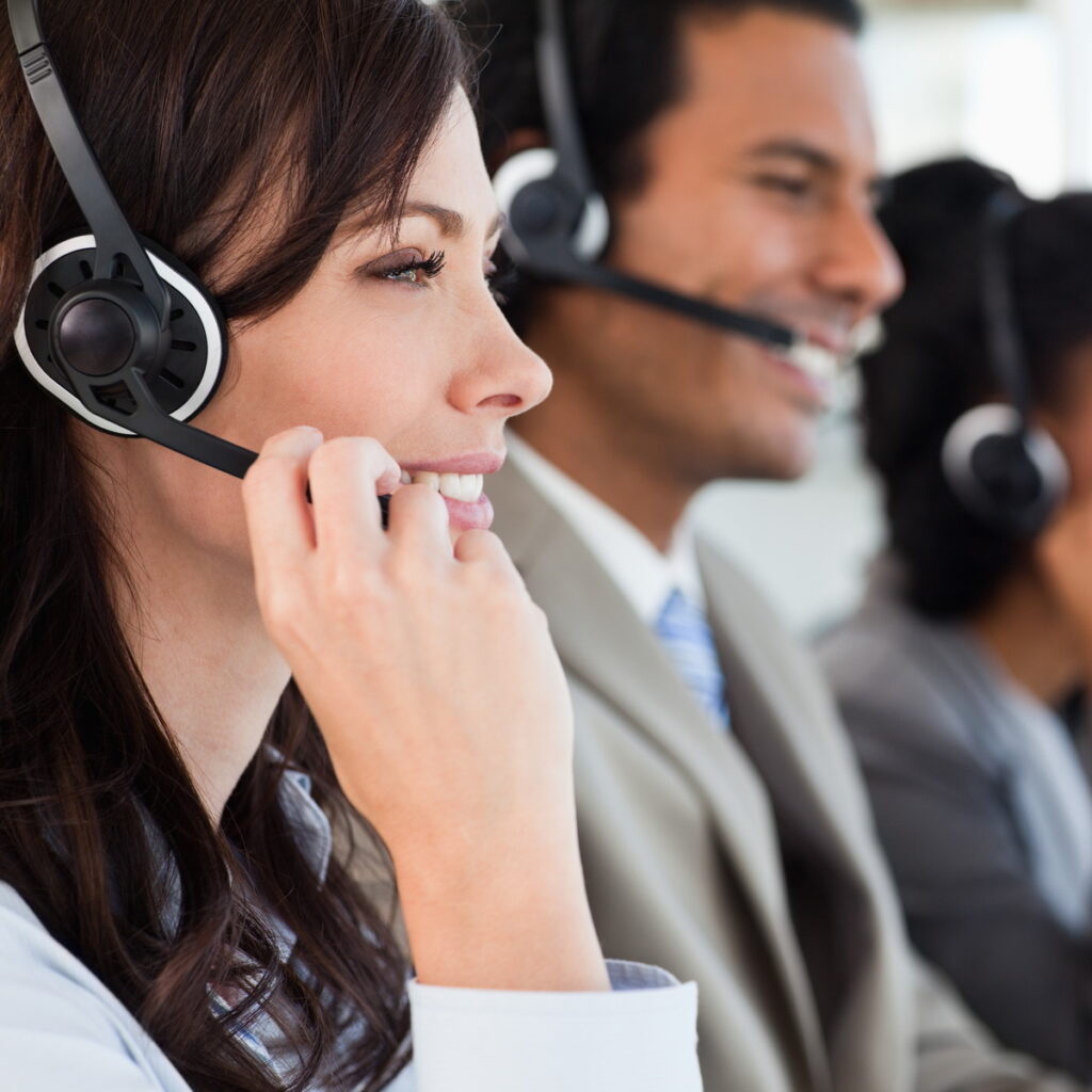 A call center employee providing communications services to businesses so that they can focus on growing their core business.