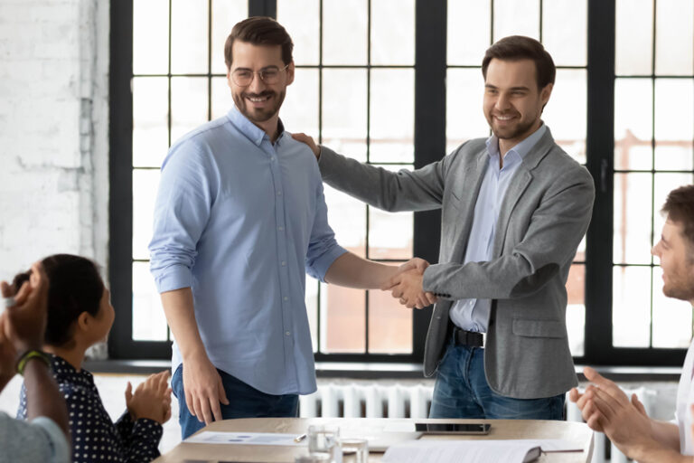 Westpark Communications Man Congratulating Employee